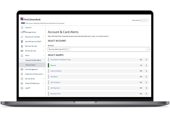 laptop screen account and card alerts page in small business digital banking