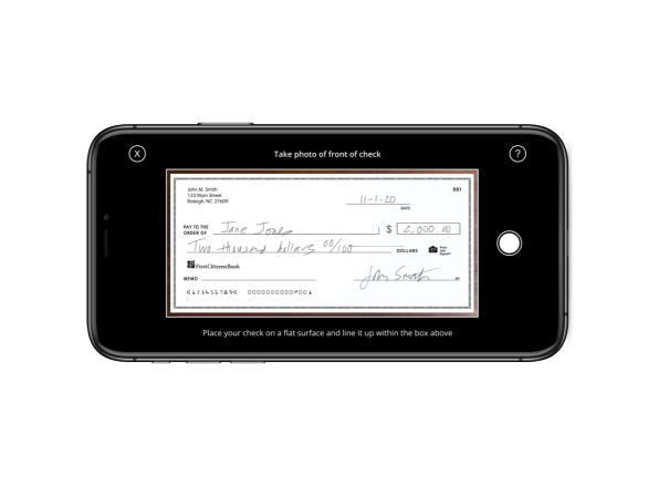 mobile phone displaying a digital image of a written check for mobile deposit